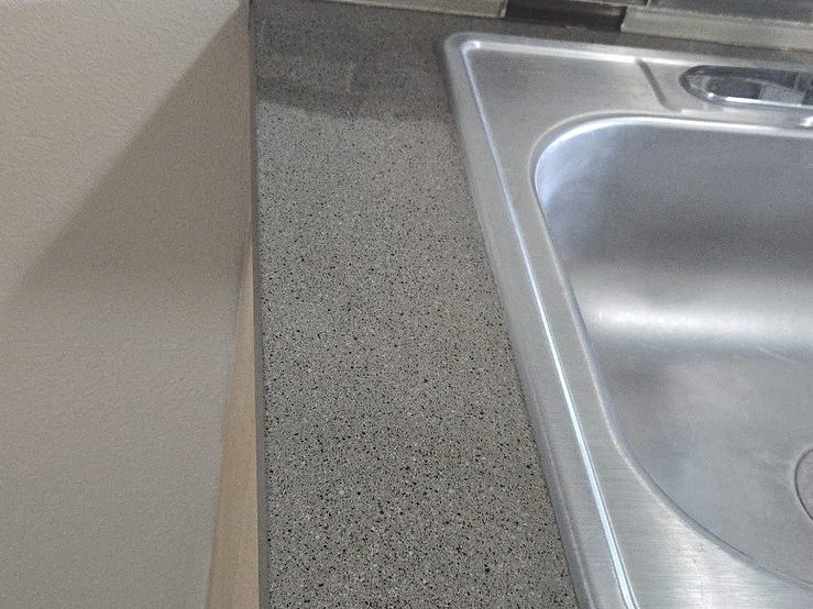 Kitchen countertop resurfaced with a durable granite-look finish by Resurface Oregon