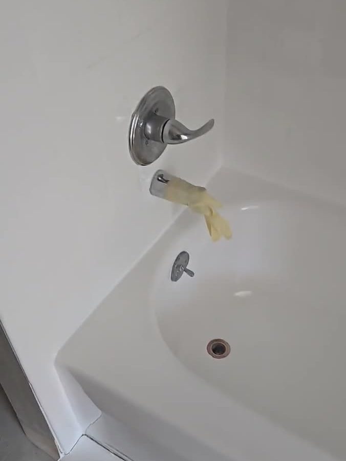 Fiberglass shower and tub-shower unit refinished with a smooth white coating by Resurface Oregon