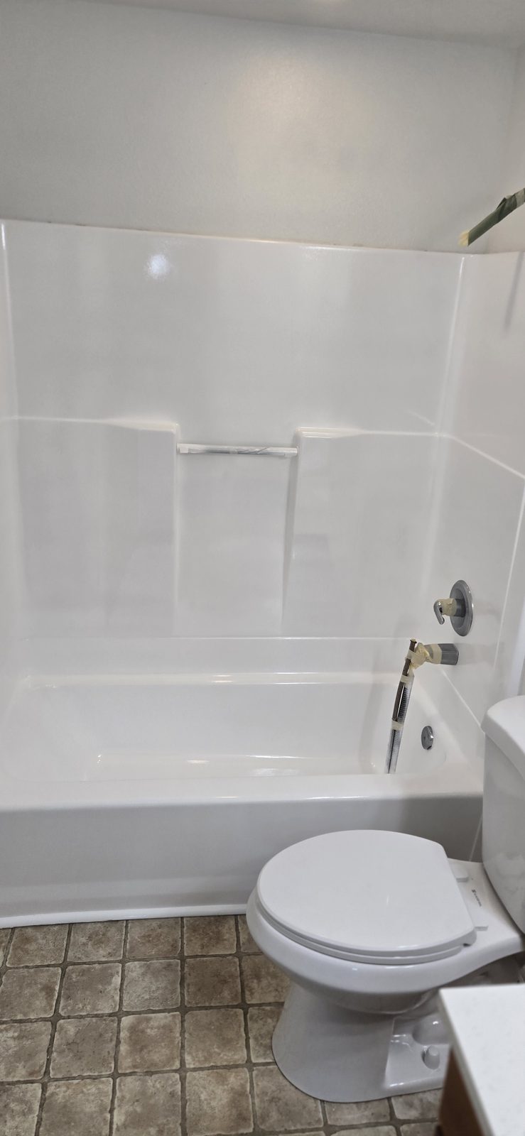 Full bathroom with the tub and surround resurfaced, bright white and ready to use