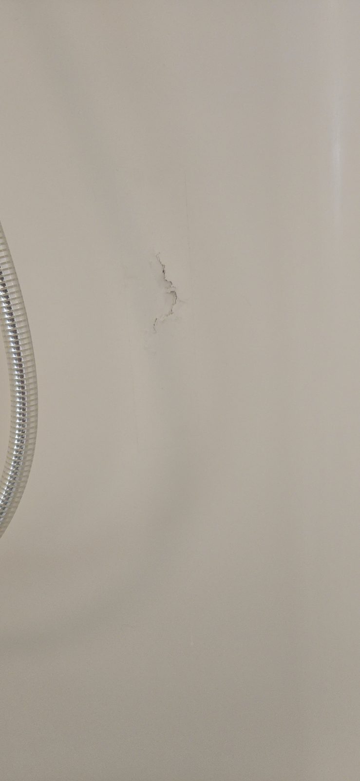 Bathtub surface after resurfacing, with a uniform glossy white finish